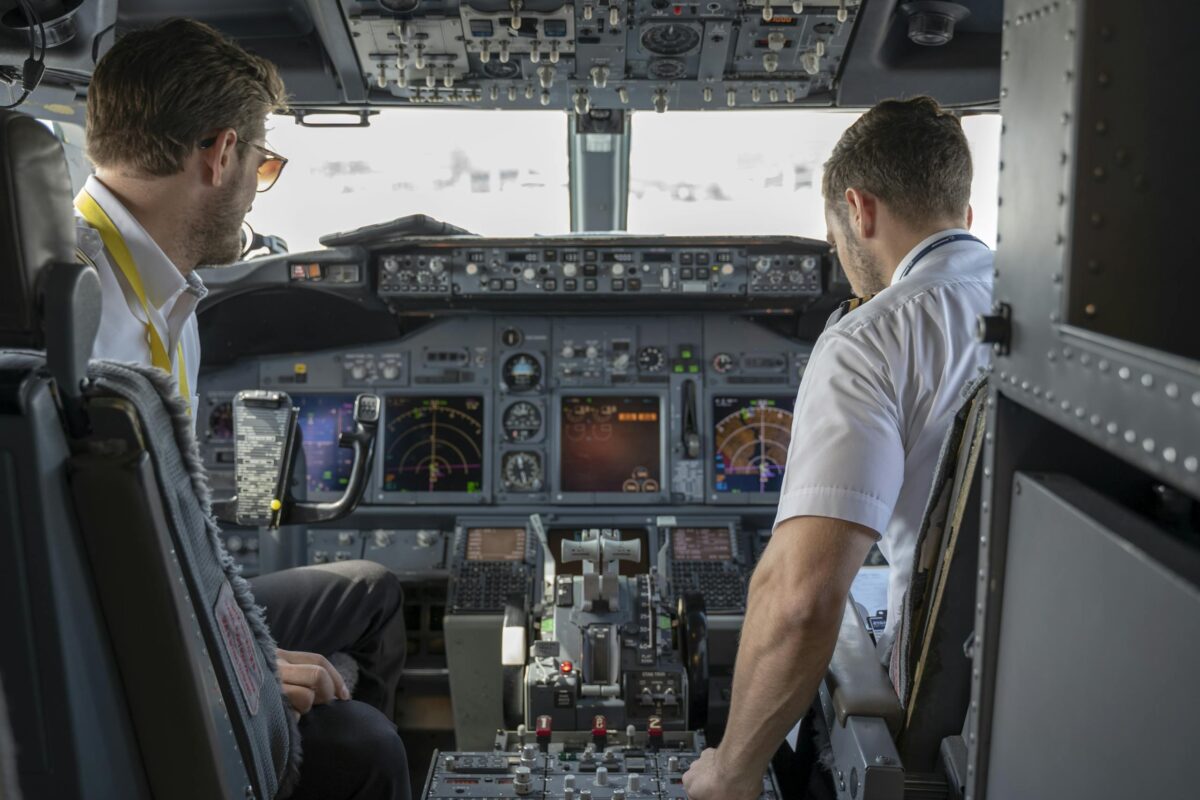 Two Pilots Sitting Inside Plane